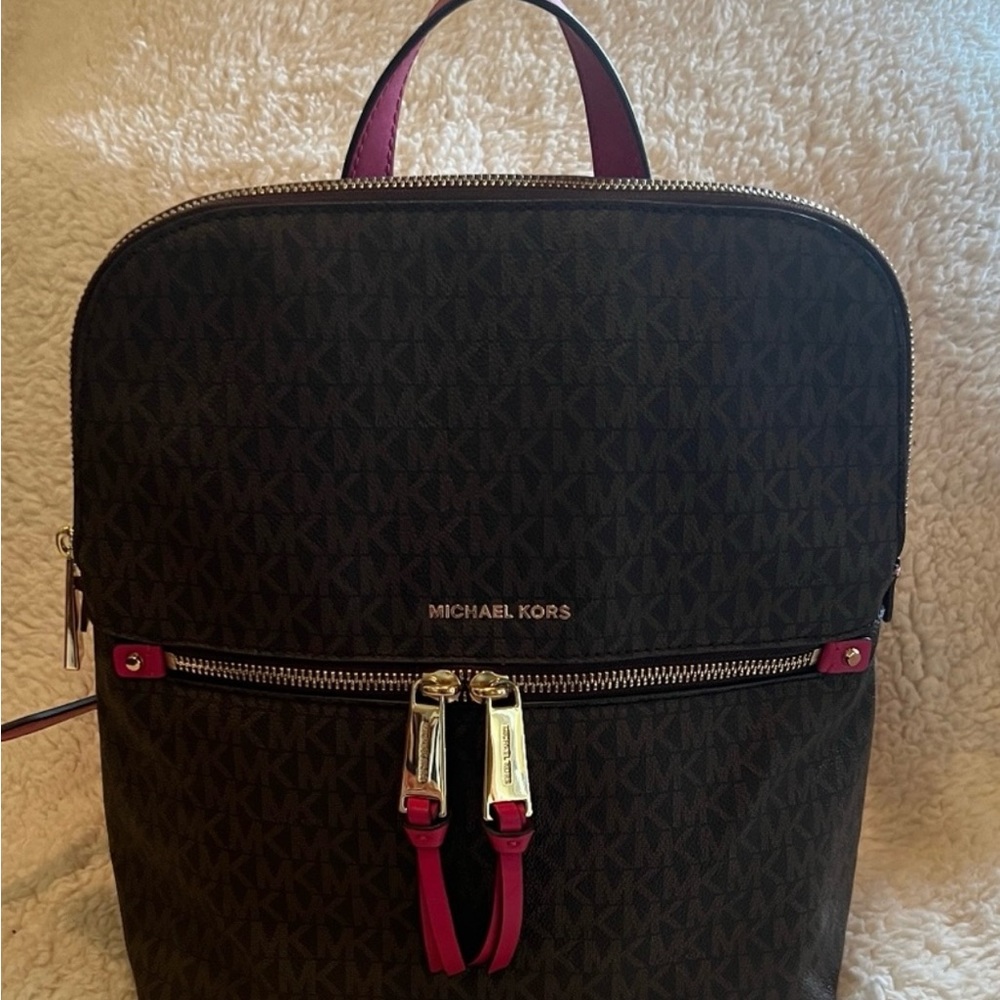 Michael kors backpack. Great like new condition. Brown and dark maroon color.